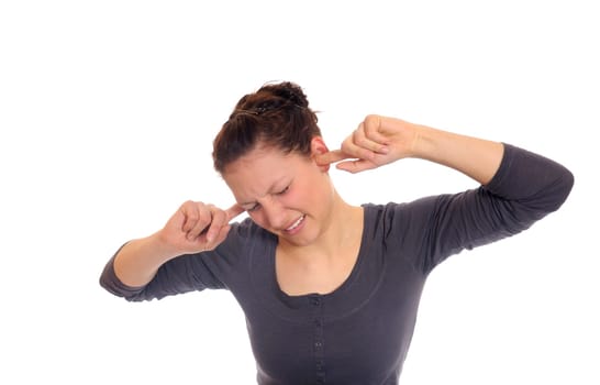 woman covers her ears