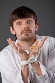 nothing can do - metaphor, doctor hands tied up over grey background