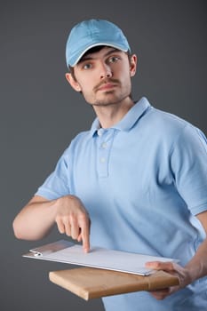 Courier man delivering a small package and requiring signature
