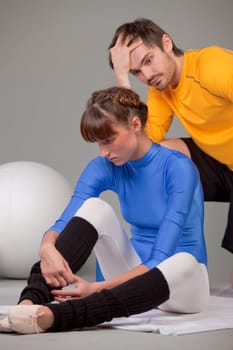 frustrated personal trainer and unhappy young woman