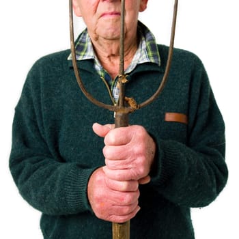 Senior man standing with pitch fork