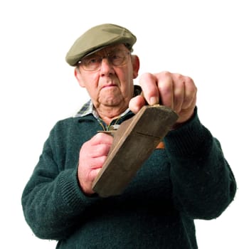 Senior Man holding old work tools