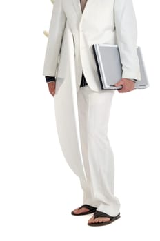 Man in white suit holding surfboard
