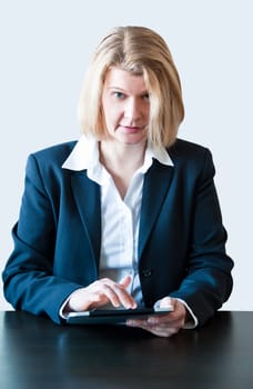 Closeup of a business woman with tablet pc and headset
