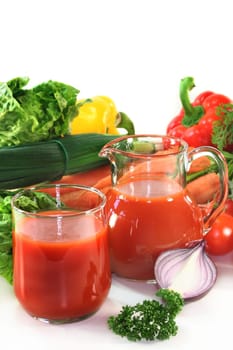 a glass of vegetable juice with fresh ingredients