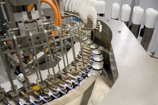 Fully automatic filling and sealing machine for the production of medicines in ampoules.