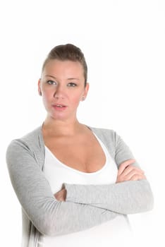 Portrait of a surprised and questioning woman with crossed arms against a white background.