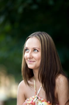beautiful woman look up in park