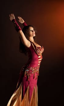 Beauty woman dance in traditional arabian costume