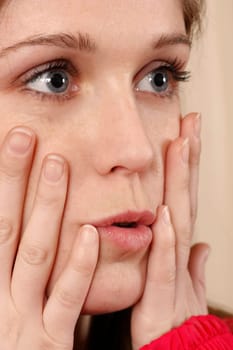 charming blonde with her hans on face