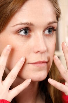 charming blonde with her hans on face