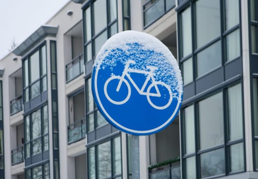 traffic sign covered with snow