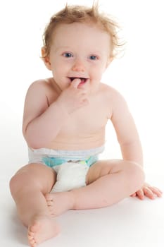 Cute baby in diaper playing on white