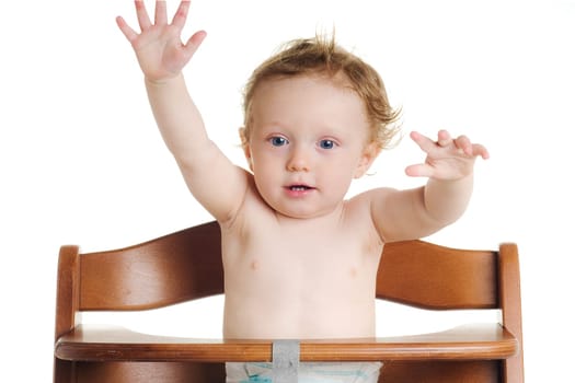 Cute hungry baby in dining chair with white background