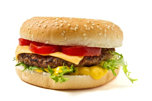 Cheeseburger and Mustard in sesame seeded bun isolated on white.