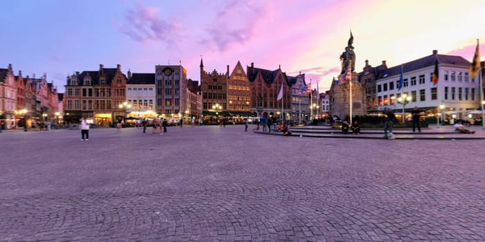 Spherical 360 panorama Bruges Grote markt square with Belfry tower and Provincial Court building famous tourist destination and in Bruges, Belgium on dusk in twilight