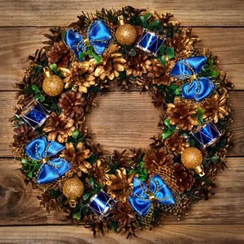 Christmas wreath on wooden background