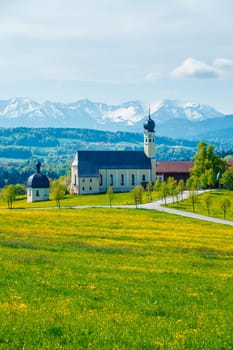 Biew of Bavaria countryside rural scene - Pilgrimage church of Wilparting in Irschenberg village. Upper Bavaria region, Germany