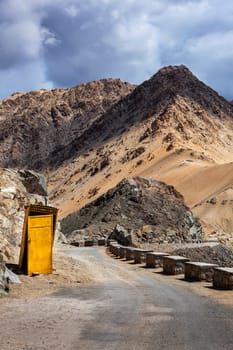 Roadside toilet booth on road in Himalayas. Leh, Ladakh, India