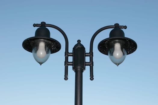 irish street light isolated on blue sky background with clipping path