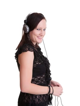 pretty young woman listening to headphones isolated on white
