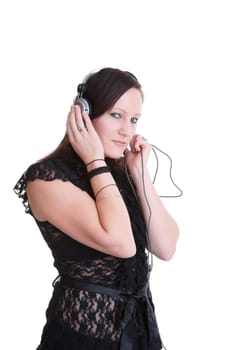 pretty young woman listening to headphones isolated on white