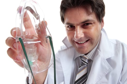Male doctor, anesthetist, obstetrician, or other healthcare professional holding a mask to administer oxygen, sedation, nitrous oxide or other drug.