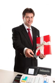 A man pays for a present with debit or credit card at the checkout.