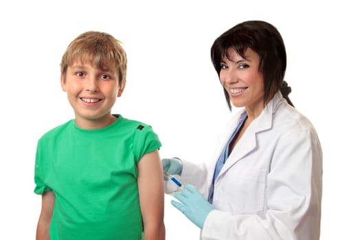 Brave happy boy receives an injection or vaccination from a friendly doctor.