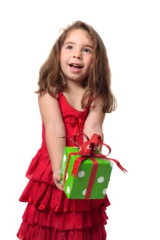 Young happy child holding a present with gleeful smile