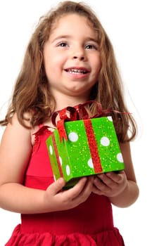 Exuberant happy child holding a present.