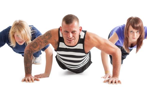 Group of three people working out  selective focus (only person in center in focus)