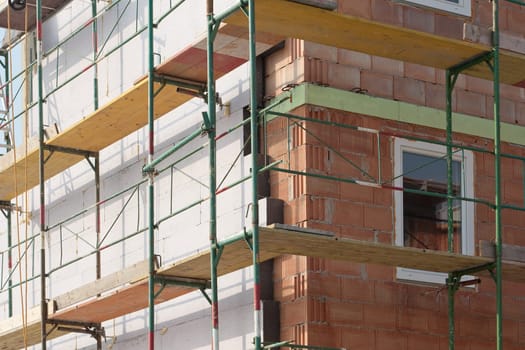 Thermal insulation,material for application to façade in shell construction
