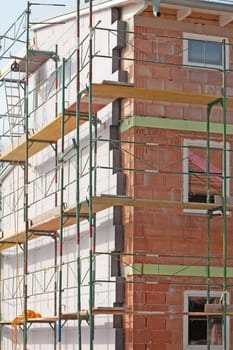 Thermal insulation,material for application to façade in shell construction