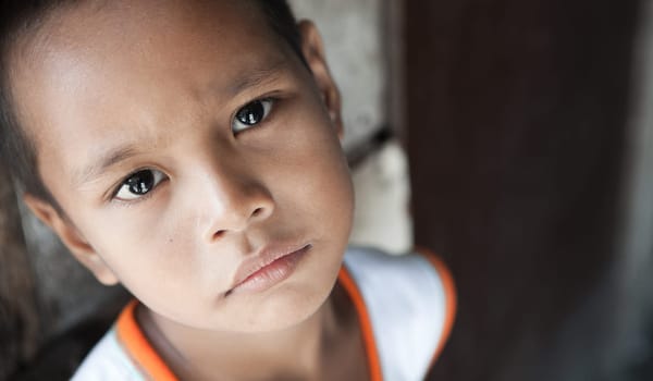 Portrait of a Filipino boy living in poverty - natural light - Manila, Philippines