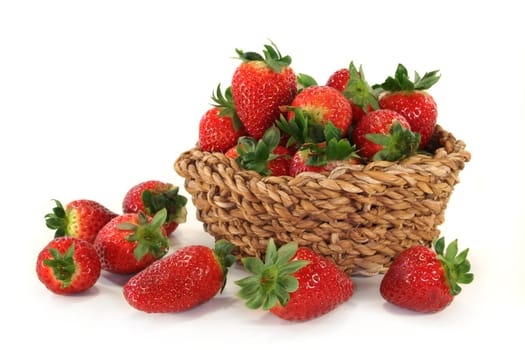 a basket of strawberries against a white background