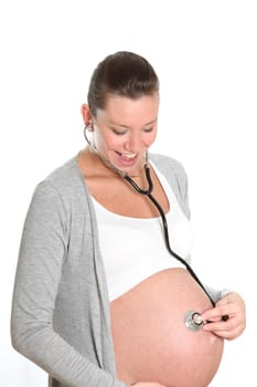 Happy, pregnant woman with stethoscope on belly hear your child and is looking forward