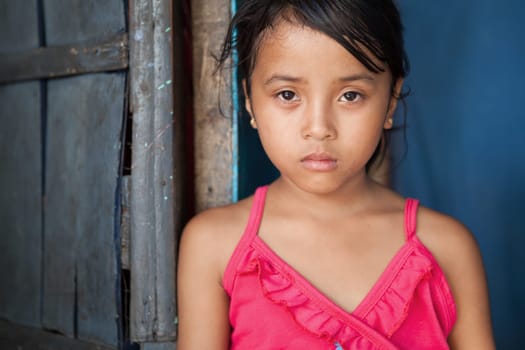 Portrait of a young girl from poverty-stricken area in Manila, the Philippines.