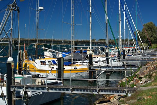 a row boats and yachts docked in the harbour