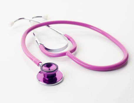 great image of pink stethoscope on white