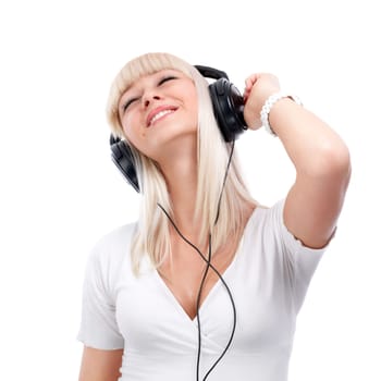 Pretty young girl enjoys listening music
