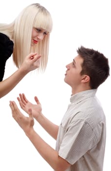 Young woman arguing with her boyfriend who ask for mercy