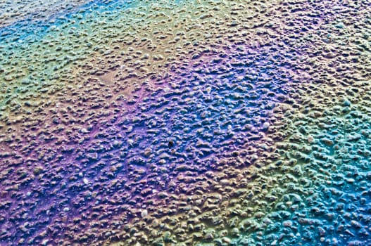 Fuel puddle on the asphalt