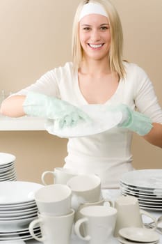 Modern kitchen - happy woman washing dishes, housework