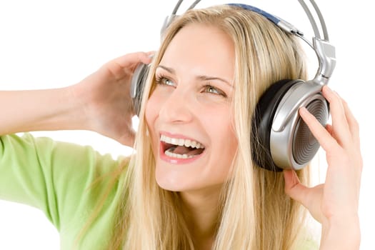 Cheerful young woman with headphones listen to music