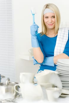 Modern kitchen - happy woman washing dishes, housework