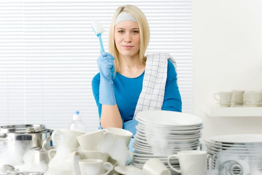 Modern kitchen - happy woman washing dishes, housework