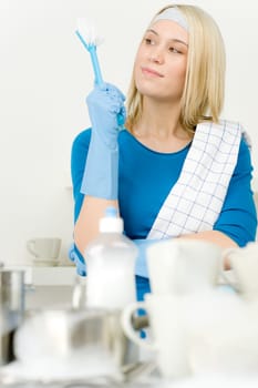 Modern kitchen - happy woman washing dishes, housework