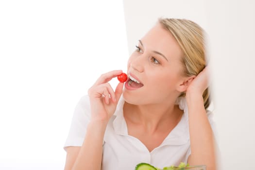 Healthy lifestyle - smiling woman with vegetable salad on white