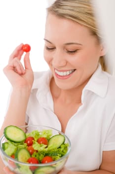Healthy lifestyle - smiling woman with vegetable salad on white
